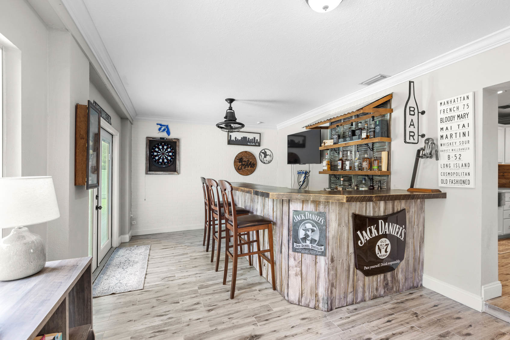 back room with custom bar with alcohol